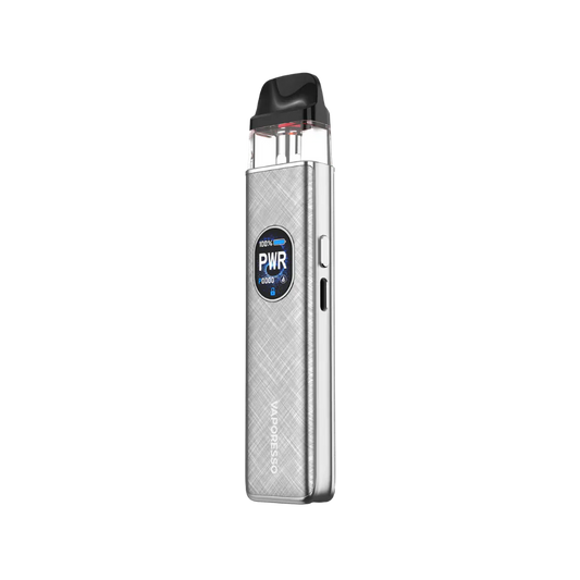 Sleek silver vaping device with a textured finish, featuring a small round digital display showing power settings. Compact, modern design.