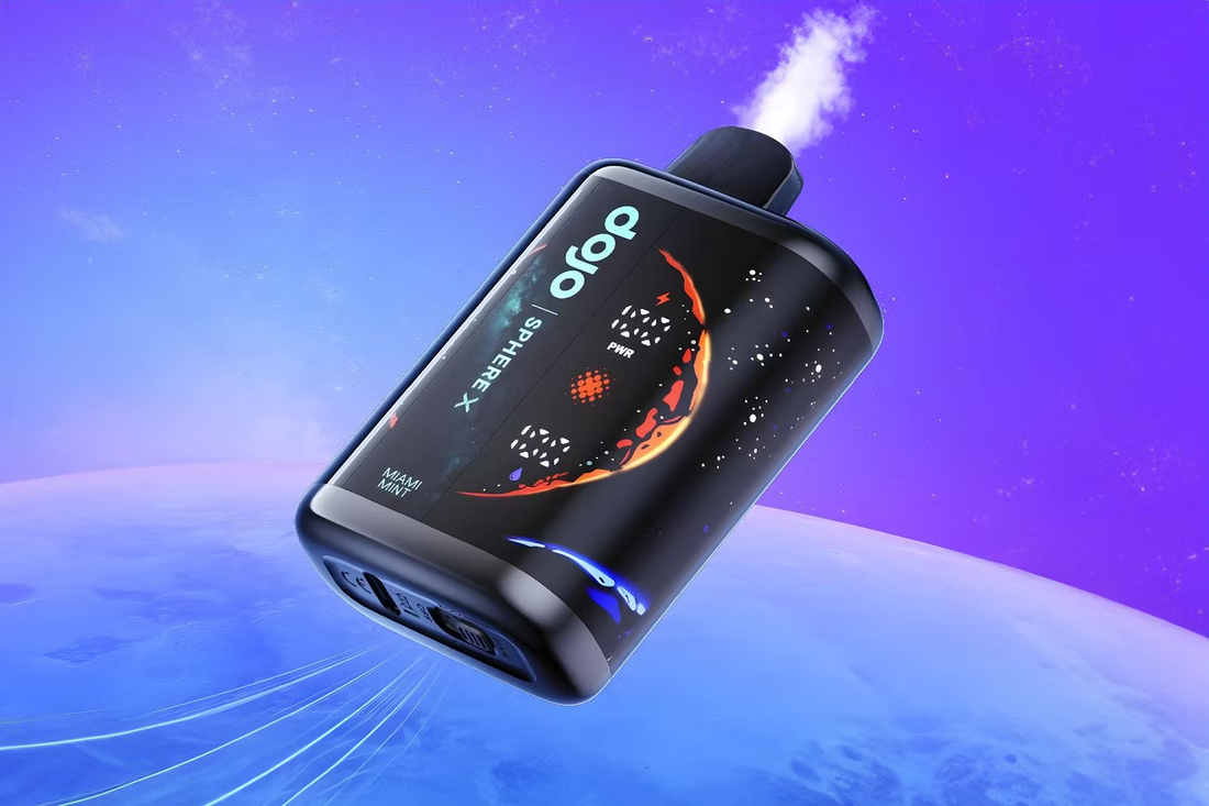 A futuristic black vape device with a cosmic design releases vapor against a purple space-like backdrop. The branding reads "Dojo Sphere X" and "Miami Mint.
