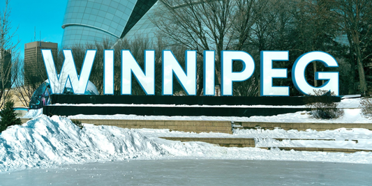 Dragon Vape online store delivery to Manitoba, featuring a vape mod against a snowy prairie background with a fire streak symbolizing fast shipping to Winnipeg and Brandon