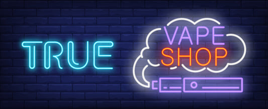 TRUE" in blue and "VAPE SHOP" for dragon vape canada in pink and orange inside a white cloud shape, against a dark brick background